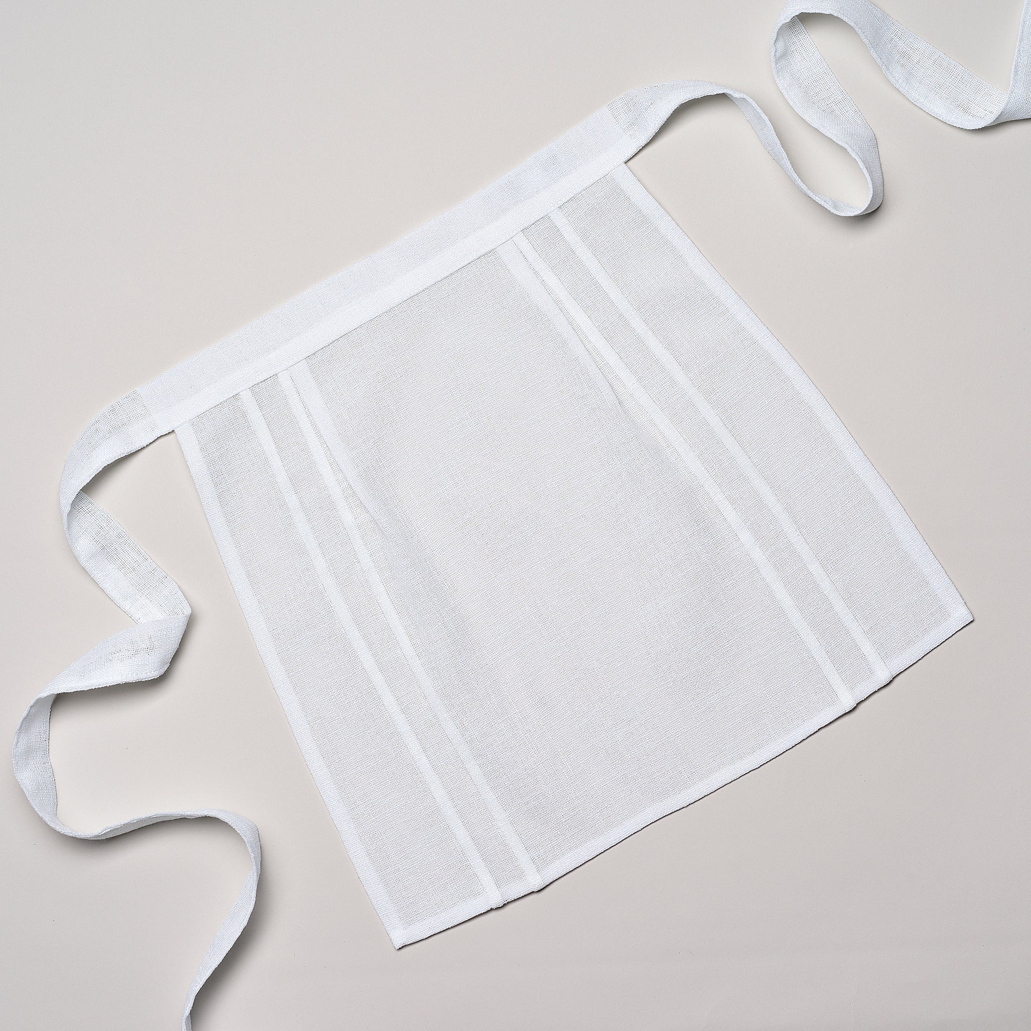DOUBLE TUCKS APRON